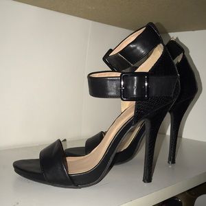 Black pumps with double ankle straps.